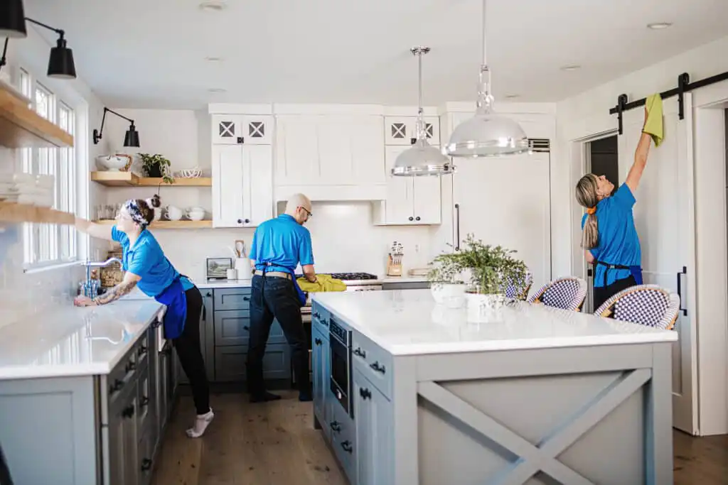 A Best Day Housecleaning cleaner cleaning a kitchen during a cleaning visit.