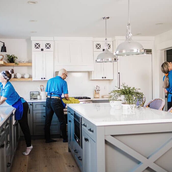 A Best Day Housecleaning cleaner cleaning a kitchen during a cleaning visit.